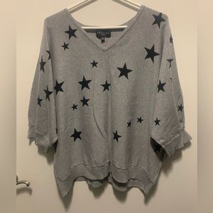 Grey dolman sleeve sweater with black stars